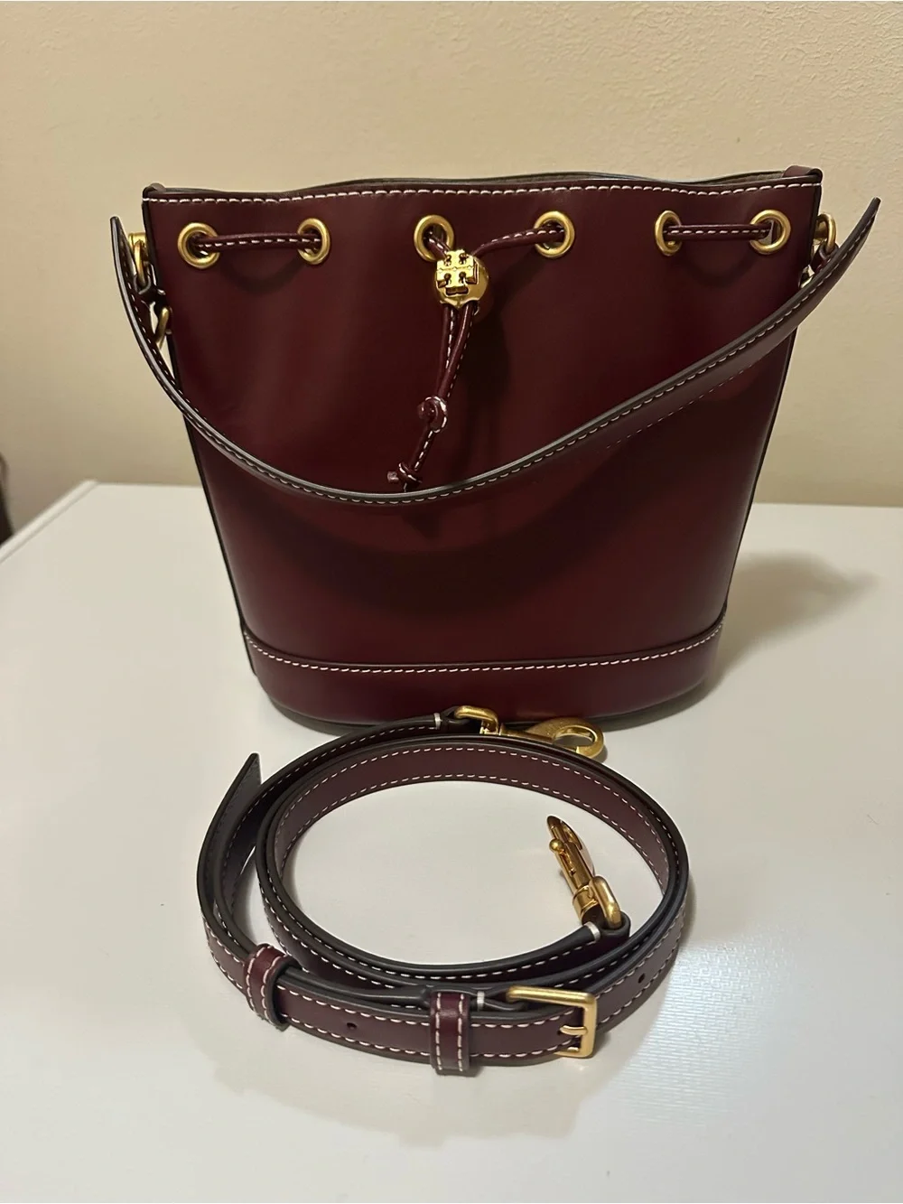 Tory Burch Leather Drawstring Bucket Bag with Gold Hardware in Huckleberry Color